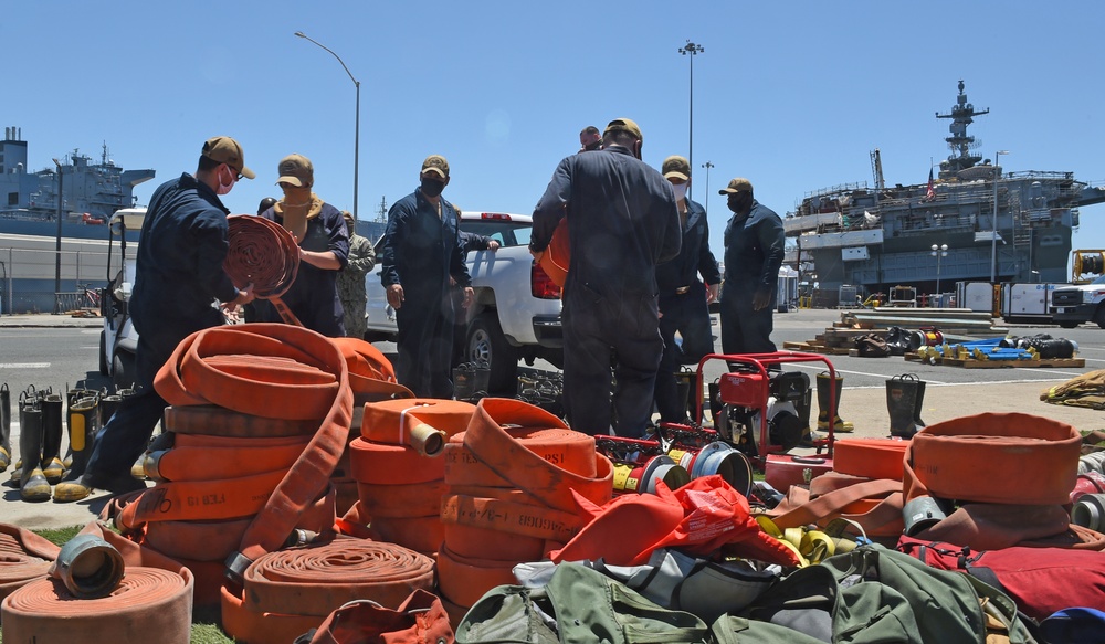 Bonhomme Richard Sailors remove firefighting equipment