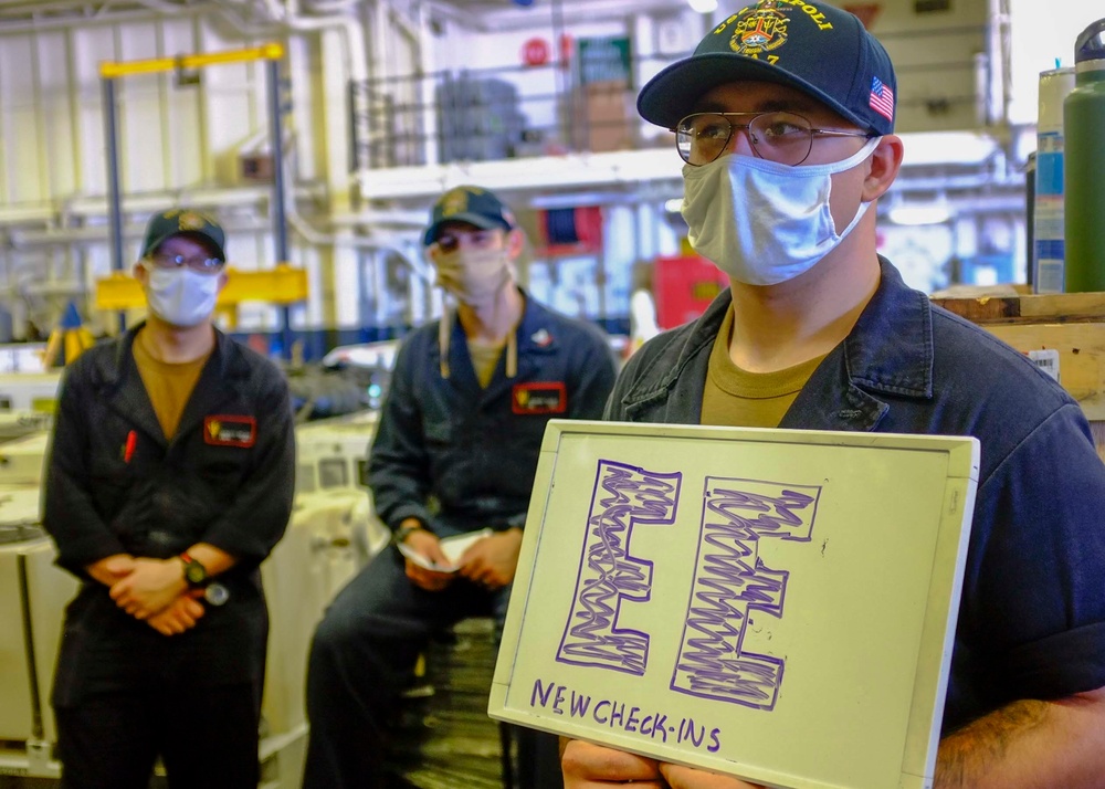 USS Tripoli crew move aboard