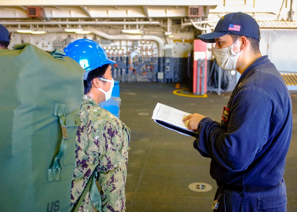 Tripoli crew move aboard