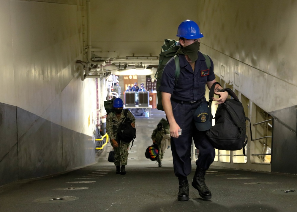 Tripoli Crew move aboard