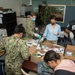 JSA/CSADD Volunteers Prepare Care Packages for ROM Sailors