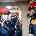 Sailors Aboard USS Germantown (LSD 42) Fight a Simulated Fire During Damage Control Training