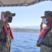 Master-at-Arms 2nd Class Steven Davis Reenlists on a harbor security patrol boat in Souda Bay, Greece