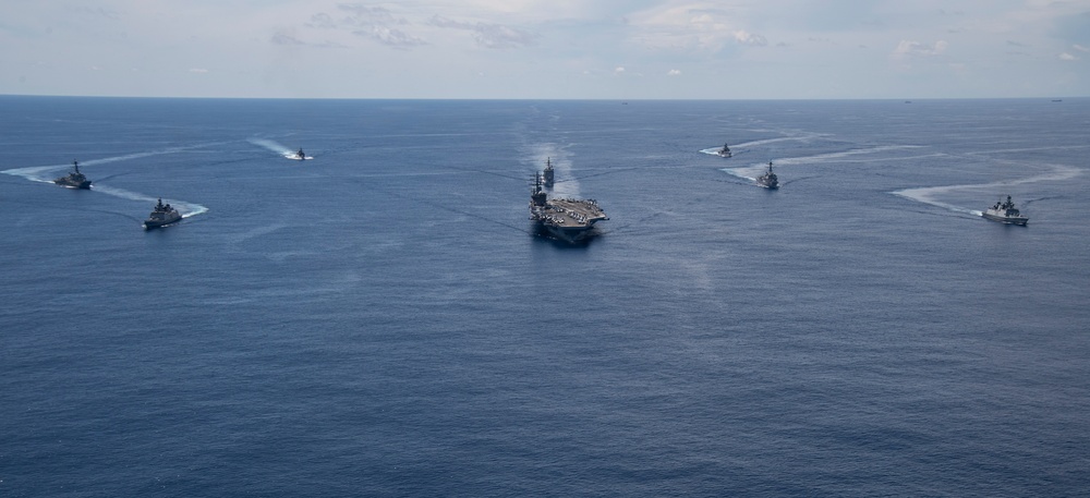 Nimitz Carrier Strike Group joins Indian Navy for cooperative deployment.
