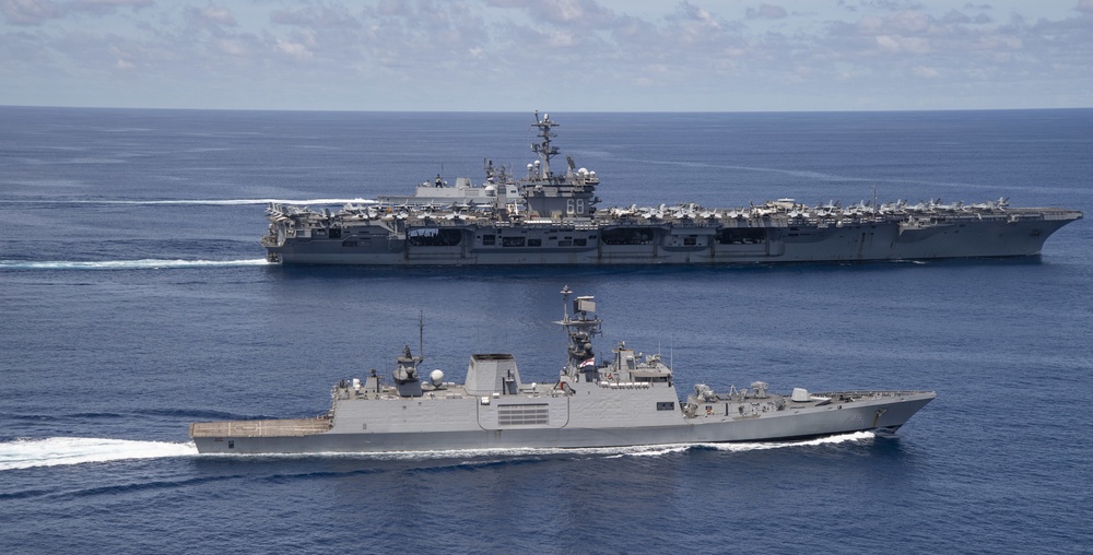 Nimitz Carrier Strike Group joins Indian Navy for cooperative deployment.