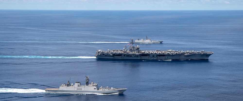 Nimitz Carrier Strike Group joins Indian Navy for cooperative deployment.