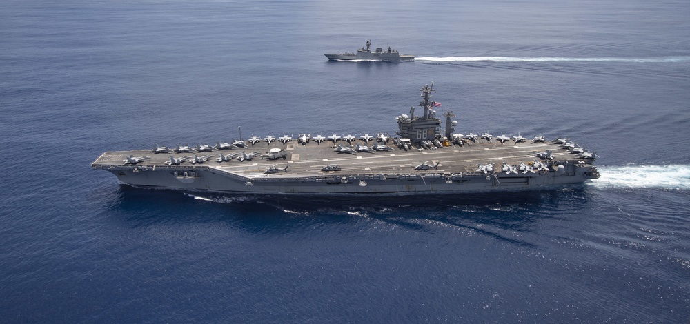 Nimitz Carrier Strike Group joins Indian Navy for cooperative deployment.