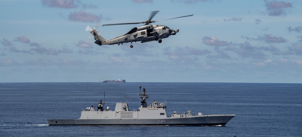 Nimitz Carrier Strike Group joins Indian Navy for cooperative deployment.