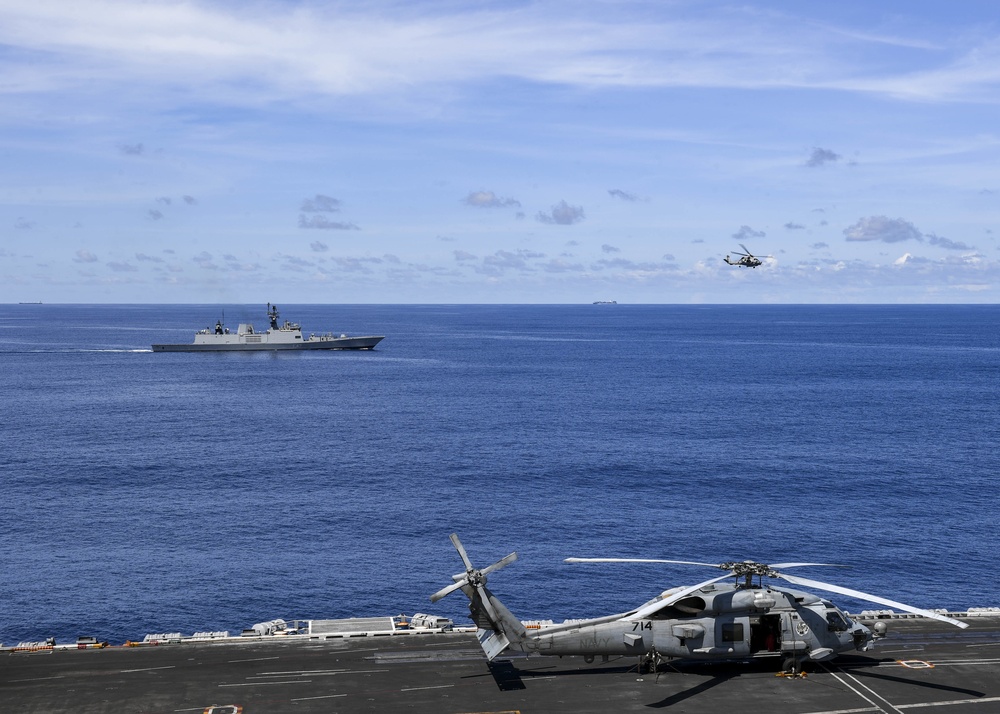 Nimitz Carrier Strike Group joins Indian Navy for cooperative deployment.