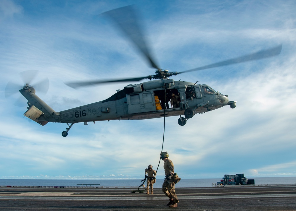 U.S. Navy Sailors Conduct Drill Aboard Aircraft Carrier
