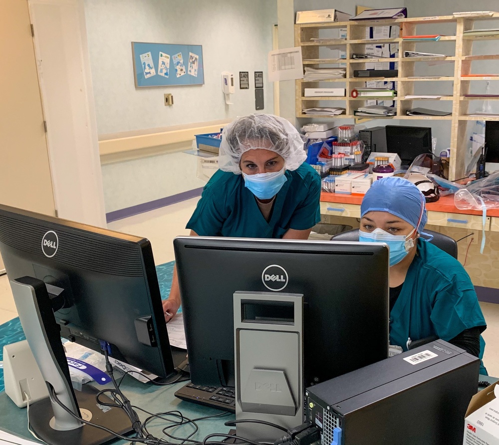 Sailors shadow staff prior to providing care at Valley Baptist Medical Center in Harlingen, Texas