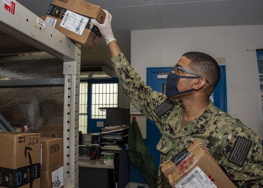 Post Office Staff Distributes Packages