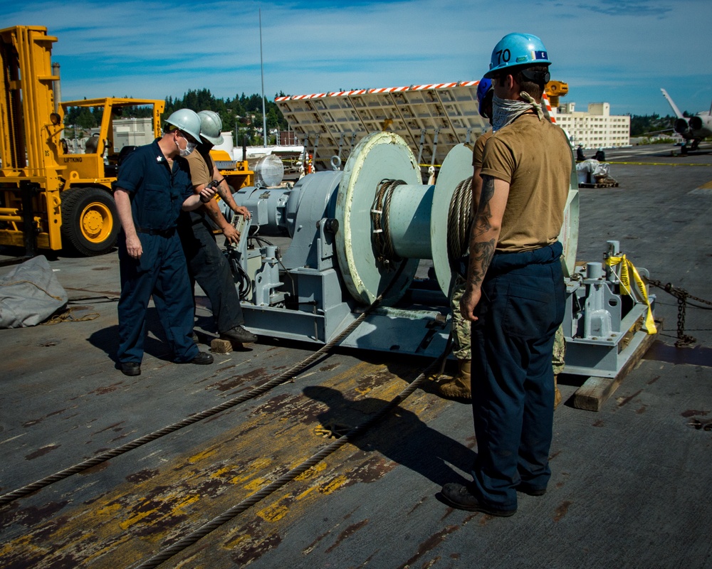 USS Carl Vinson (CVN 70) Sailors Replace Arresting Cable