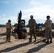 Airmen excavate work site