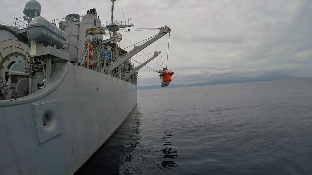 Mine neutralization vehicle is lowered into the water