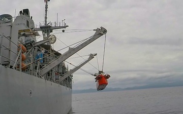 Mine neutralization vehicle is lowered into the water