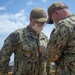 Aviation Electrician’s Mate 3rd Class Zachary Hansenmcphail is promoted by USS Constitution Commanding Officer Cmdr. John Benda