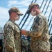 Aviation Machinist Mate 3rd Class Braidon Morrison is promoted by Boatswain’s Mate 1st Class Corey VanBeveren aboard USS Constitution