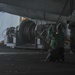 U.S. Navy Sailors Conduct Maintenance on Fighter Jet