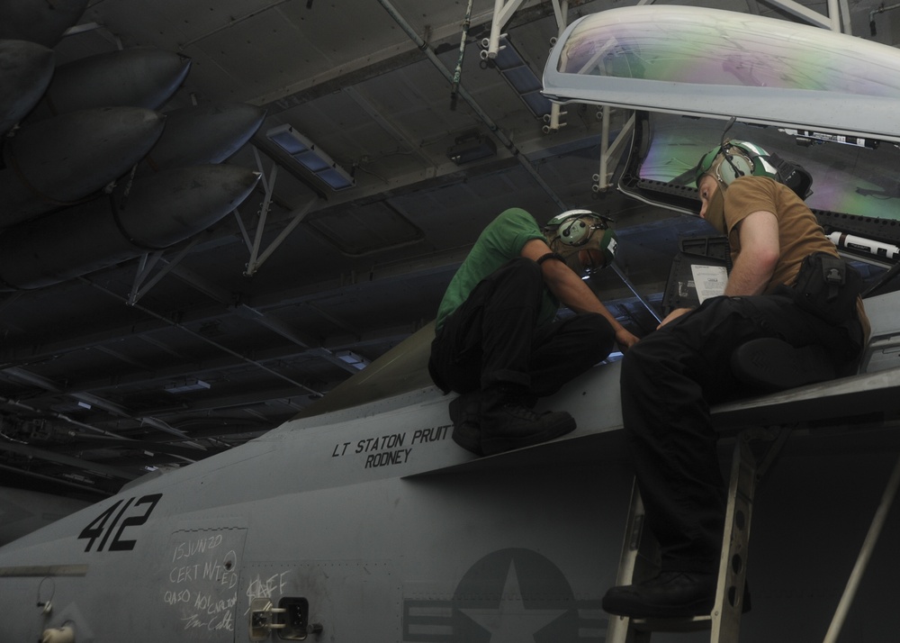 U.S. Navy Sailors Conduct Fighter Jet Maintenance