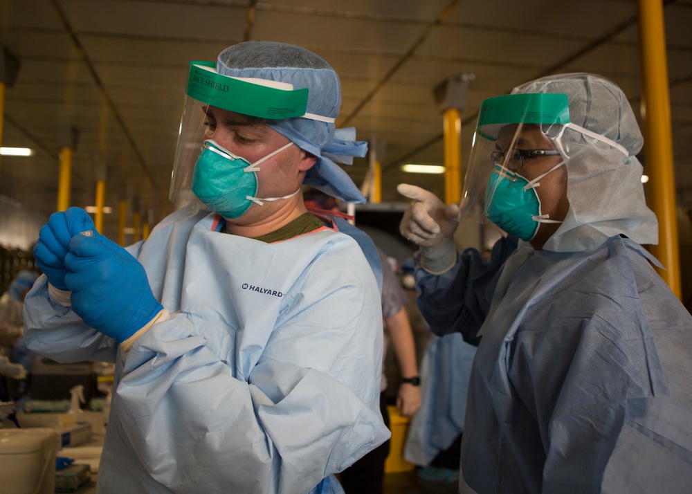 Testing, attention please | Marines conduct COVID testing upon arrival in the Republic of Palau