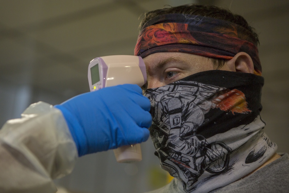 Testing, attention please | Marines conduct COVID testing upon arrival in the Republic of Palau