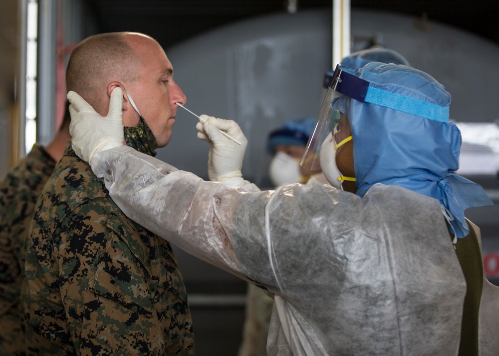 Testing, attention please | Marines conduct COVID testing upon arrival in the Republic of Palau