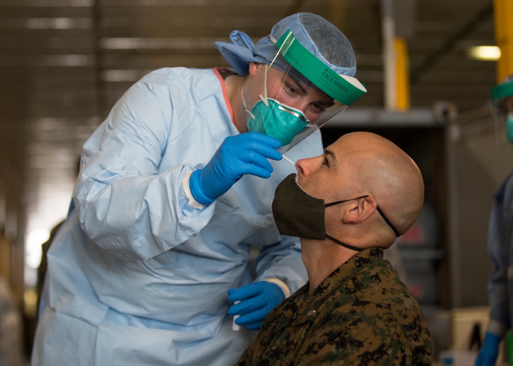 Testing, attention please | Marines conduct COVID testing upon arrival in the Republic of Palau