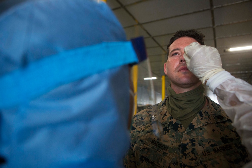 Testing, attention please | Marines conduct COVID testing upon arrival in the Republic of Palau
