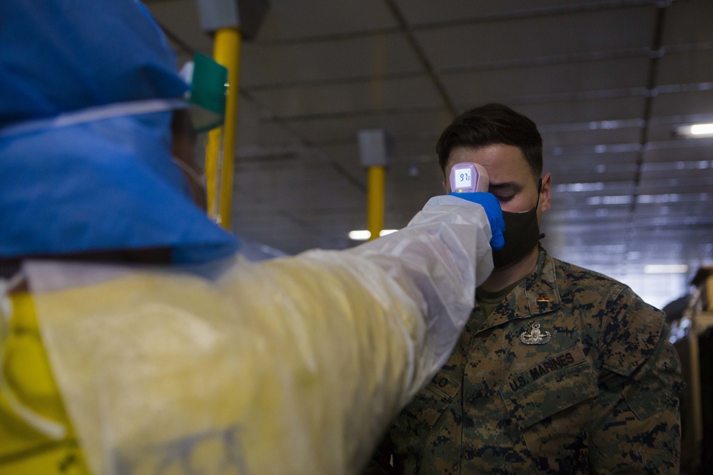 Testing, attention please | Marines conduct COVID testing upon arrival in the Republic of Palau