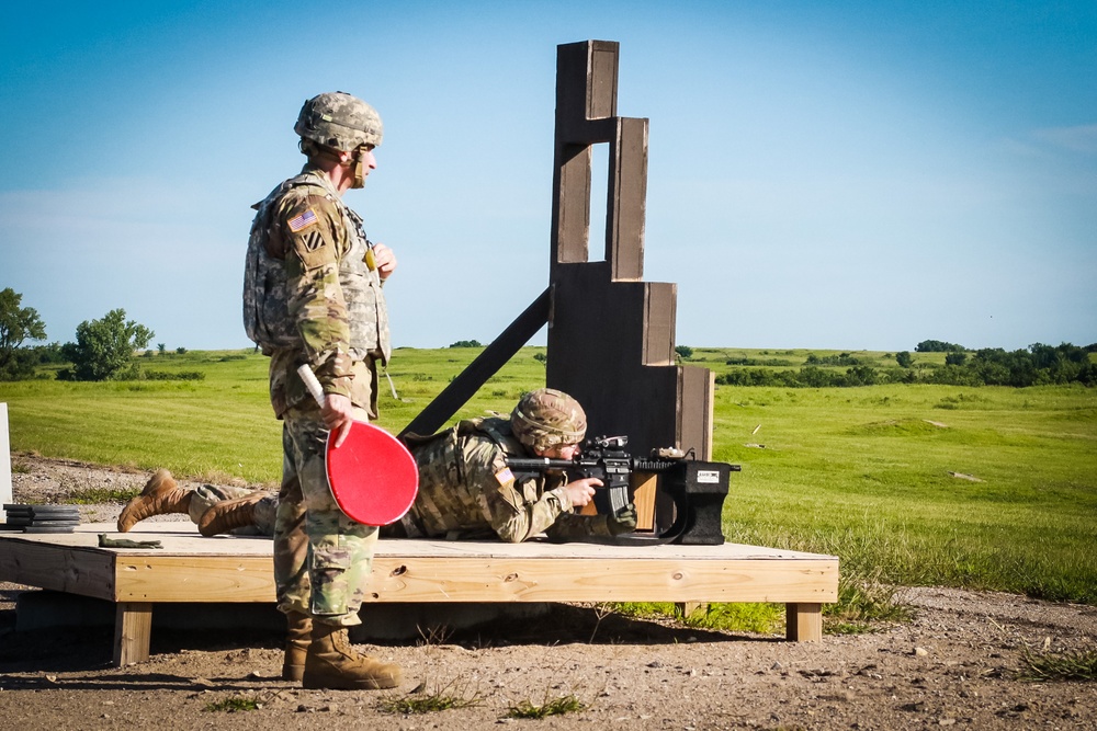 1st Infantry Division Soldiers perform rifle marksmanship qualification at the range.