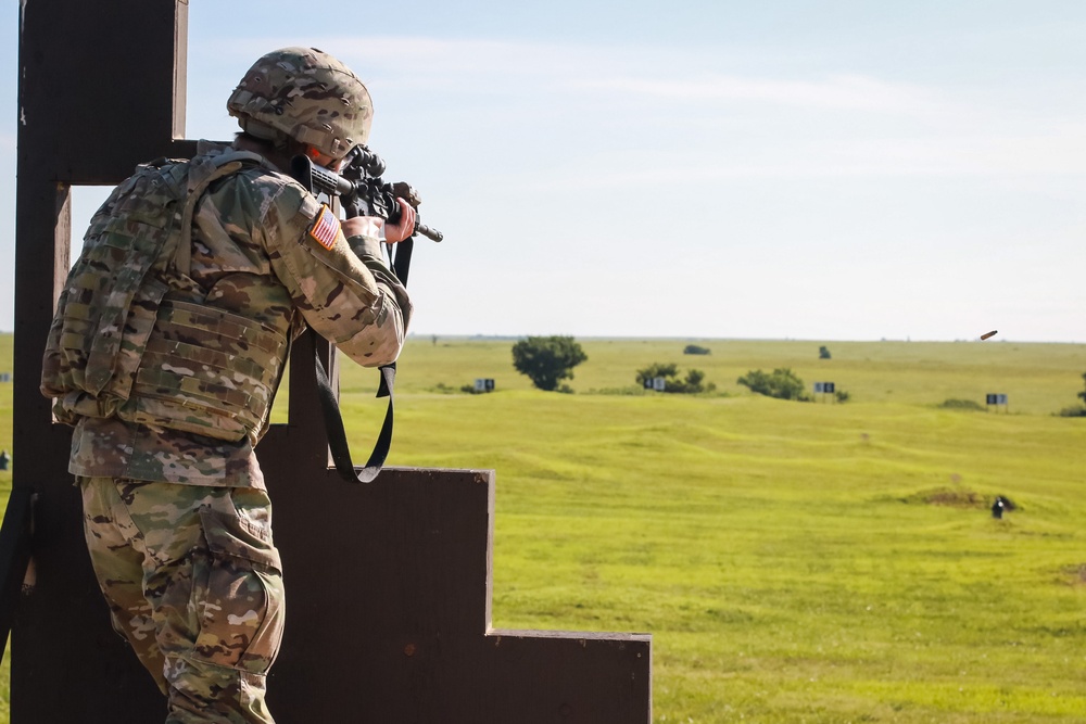 1st Infantry Division Soldiers perform rifle marksmanship qualification at the range.