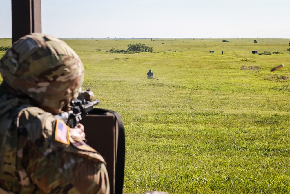 1st Infantry Division Soldiers perform rifle marksmanship qualification at the range.