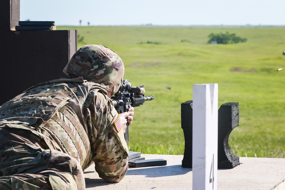 1st Infantry Division Soldiers perform rifle marksmanship qualification at the range.