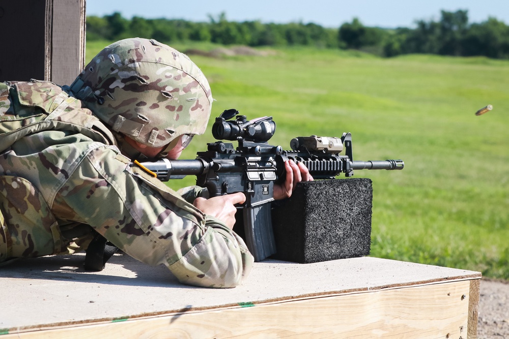 1st Infantry Division Soldiers perform rifle marksmanship qualification at the range.