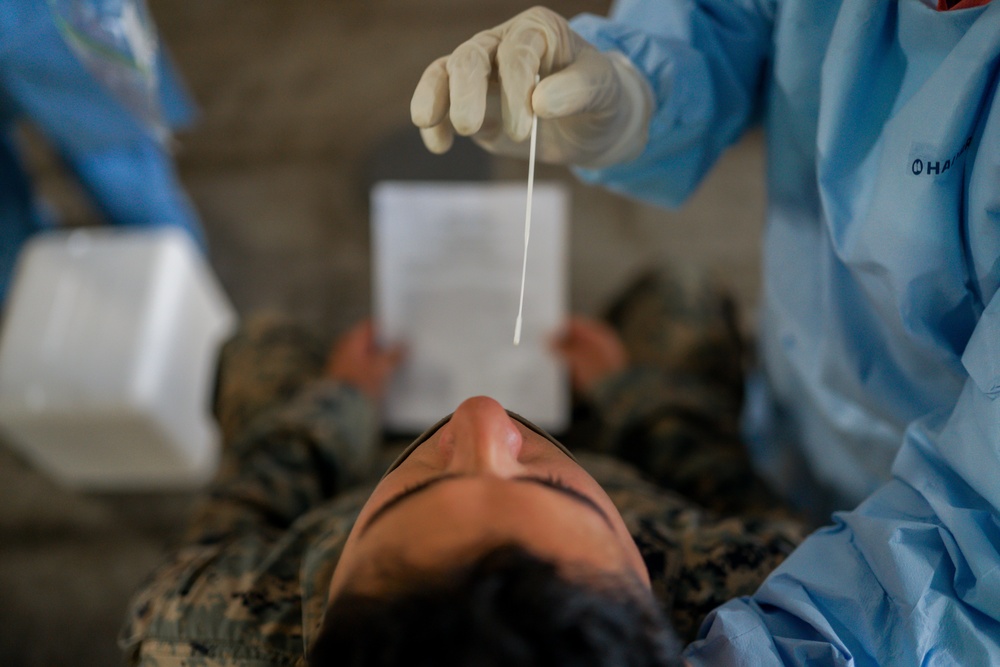 Testing attention please | Marines conduct COVID testing upon arrival in the Republic of Palau