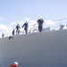 U.S. Navy ships get underway in preparation for Hurricane Douglas