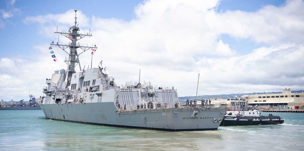 U.S. Navy destroyers get underway in preparation for Hurricane Douglas