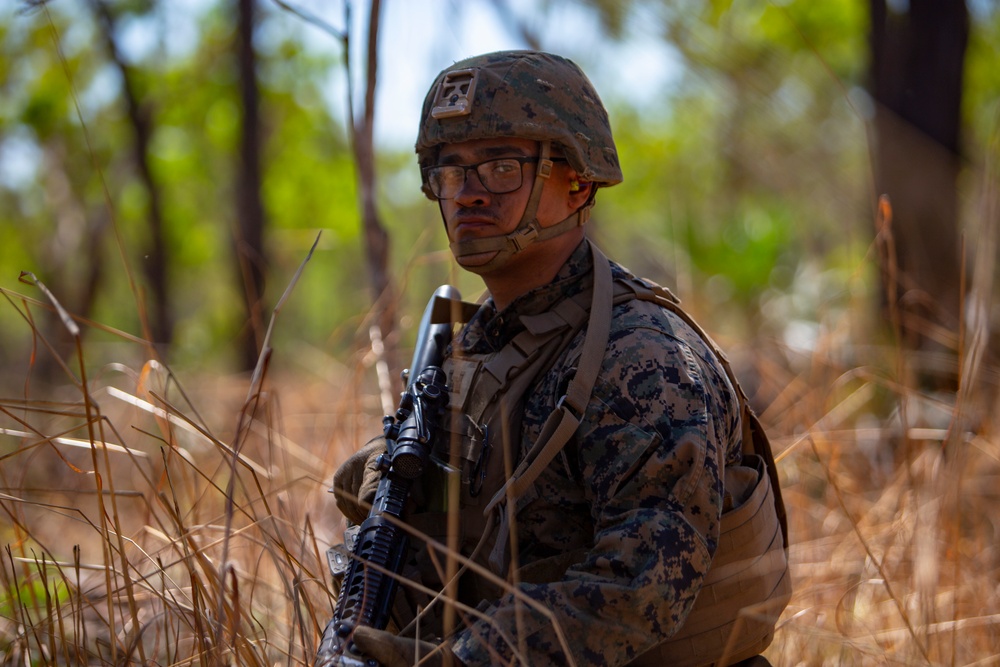 Marines participate in a live fire and maneuver range