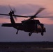 Idaho's Black Hawk helicopter flying in the sunset