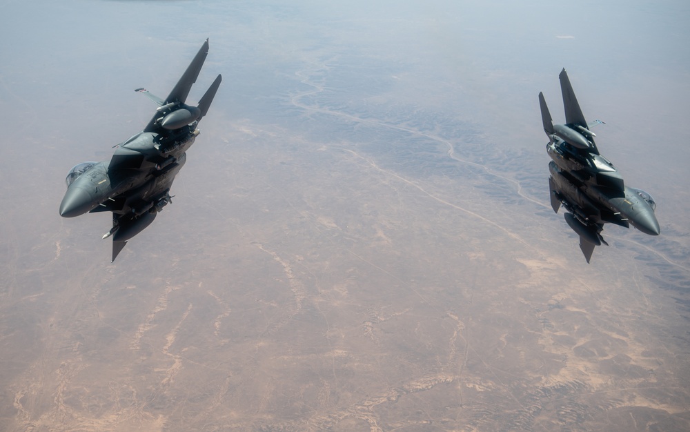 A U.S. Air Force KC-135 Stratotanker refuels F-15E Strike Eagle