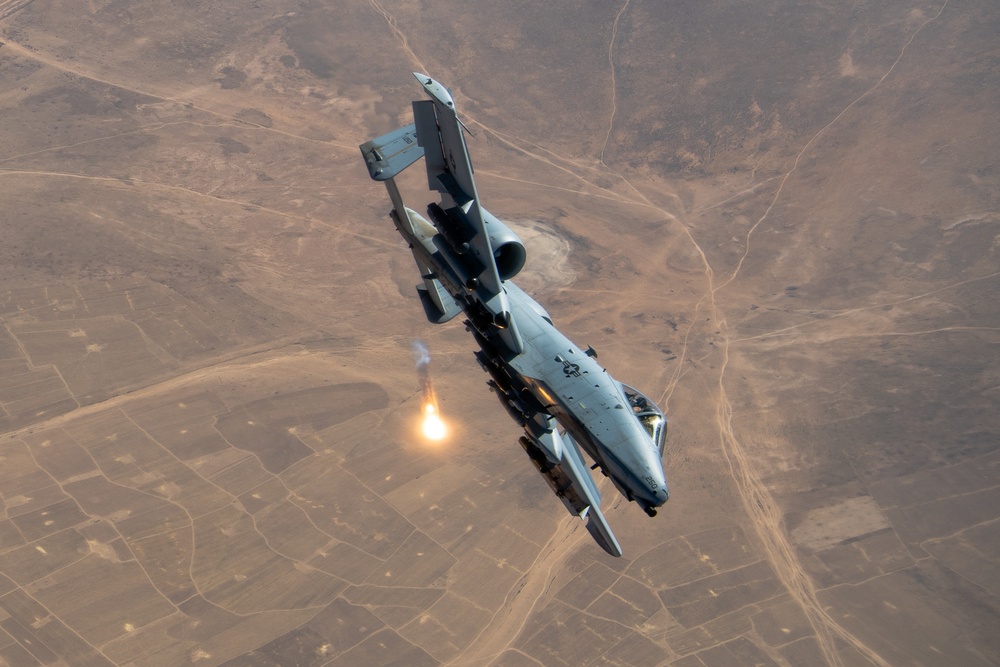 A U.S. Air Force KC-135 Stratotanker refuels A-10 Thunderbolts.