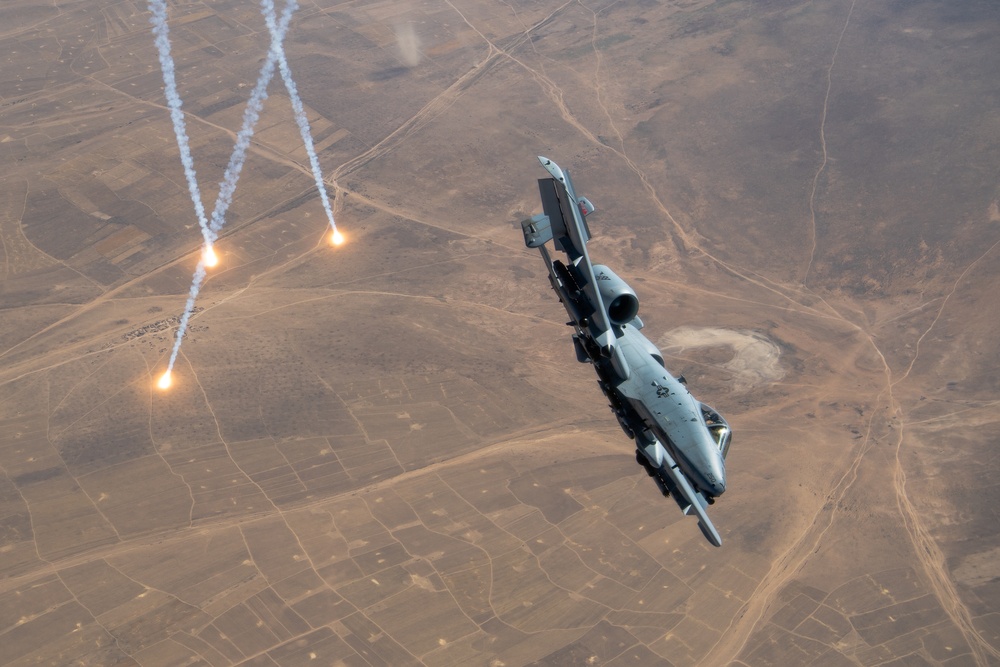 A U.S. Air Force KC-135 Stratotanker refuels A-10 Thunderbolts.