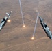 A U.S. Air Force KC-135 Stratotanker refuels A-10 Thunderbolts.