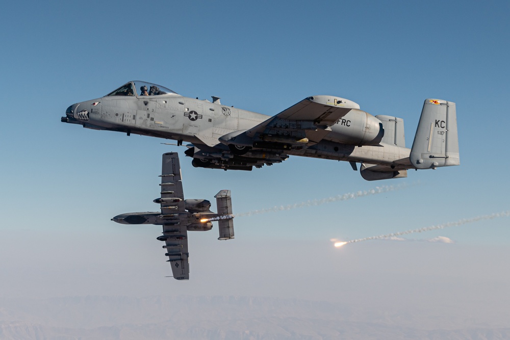 A U.S. Air Force KC-135 Stratotanker refuels A-10 Thunderbolts.