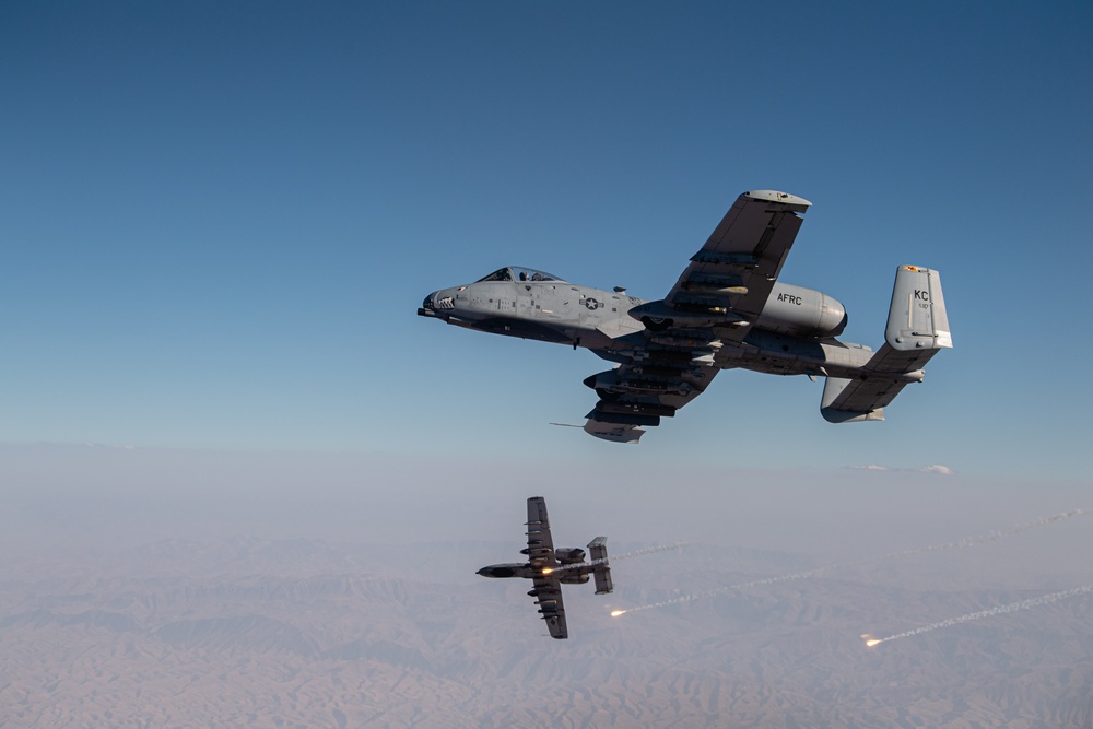 A U.S. Air Force KC-135 Stratotanker refuels A-10 Thunderbolts.