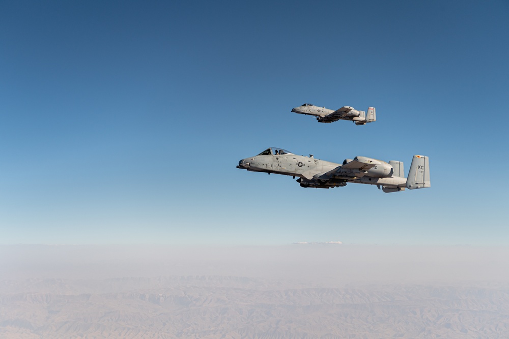 A U.S. Air Force KC-135 Stratotanker refuels A-10 Thunderbolts.