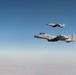 A U.S. Air Force KC-135 Stratotanker refuels A-10 Thunderbolts.