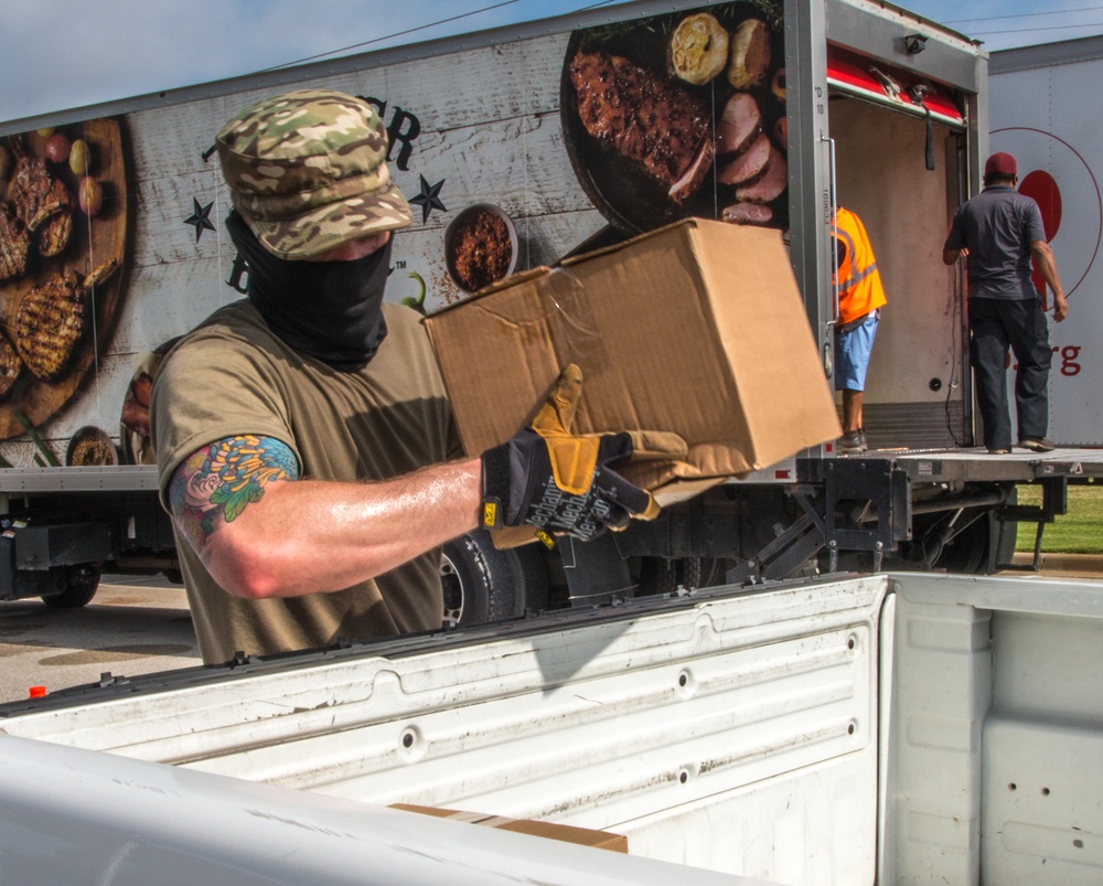 Citizen Airmen Distribute Food to Community in Need