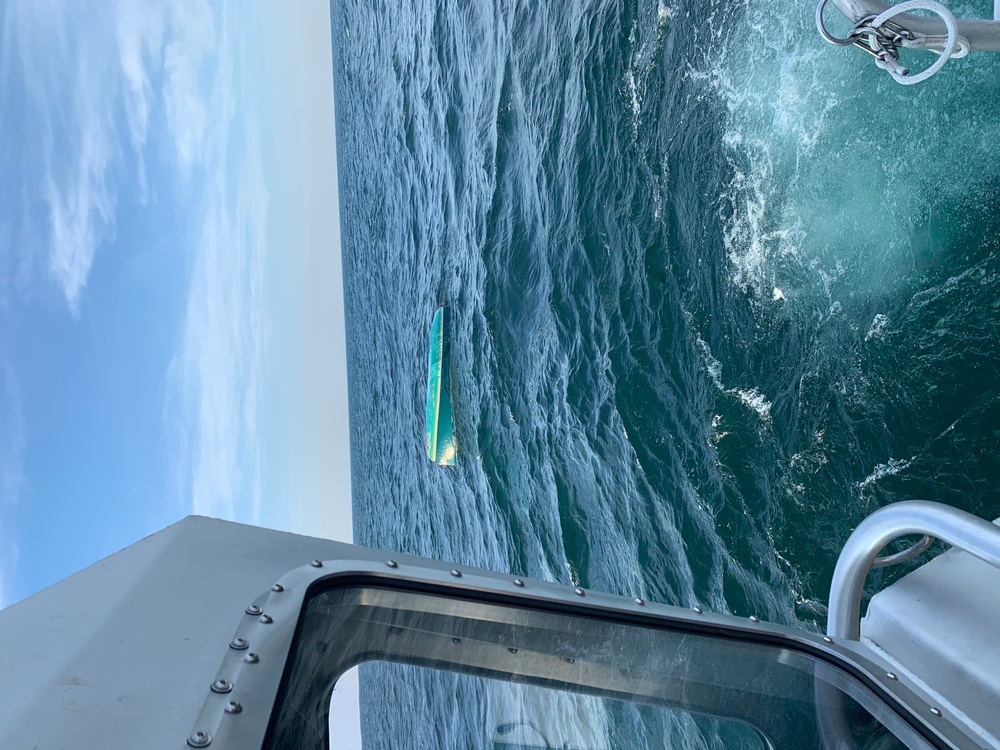 Coast Guard spots capsized sailboat